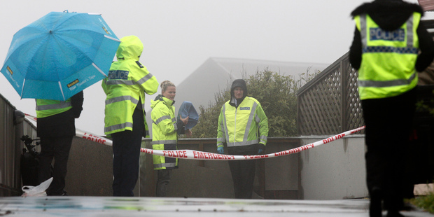 Police officers during their investigation at the Kentwood Drive property. Photo / Mark MItchell