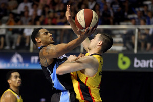 Corey Webster of the Breakers attempts to score past the outstretched arms of Chris Goulding of the Melbourne Tigers. Photo / Getty Images