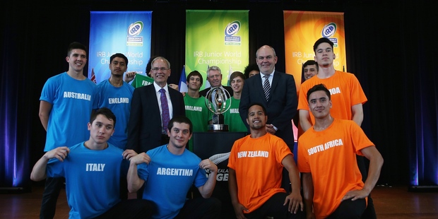 Auckland Mayor Len Brown, NZRU Chief Executive Steve Tew and Minister for Economic Development, Hon Steven Joyce pose for a photo with hip hop dancers. Photo / Getty Images.