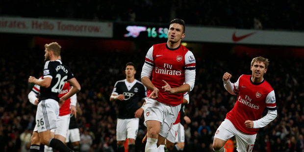 Arsenal's Olivier Giroud, center, celebrates scoring a penalty and his second goal of the game during the English Premier League soccer match between Arsenal and Southampton. Photo / AP