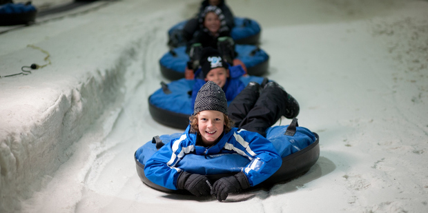 Snowplanet, an indoor ski slope in North Auckland, has a white Christmas, complete with a visit from Santa. Photo / Paul Abbott