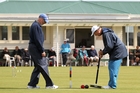 Paul Stuart (left) supervises his partner and fellow Gisborne player during yesterday's final round of doubles play at the North Island Croquet Championships in Napier. Photo/Duncan Brown. Paul Stuart (left) supervises his partner and fellow Gisborne player during yesterday's final round of doubles play at the North Island Croquet Championships in Napier. Photo/Duncan Brown.