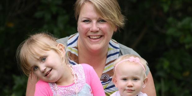 Rhonwyn Newson was shocked to be fined for driving in a T2 lane with her two children, Maddison and Olivia.