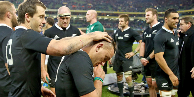 Ben Smith congratulates Aaron Cruden after the All Blacks number 10 kicked the winning conversion to bear Ireland. Photo / Getty Images