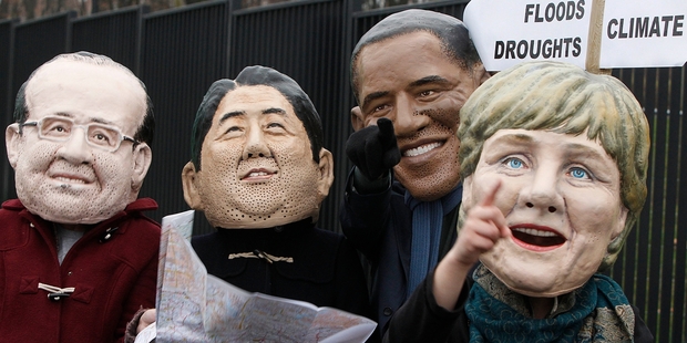 Climate activists protest in the guises of Francois Hollande, Shinzo Abe, Barack Obama and Angela Merkel. Photo / AP