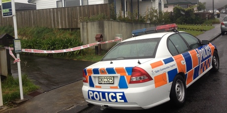 Police officers during their investigation at the Woodridge property where a woman made a desperate 111 call this morning and was later found dead. Photo / Mark Mitchell