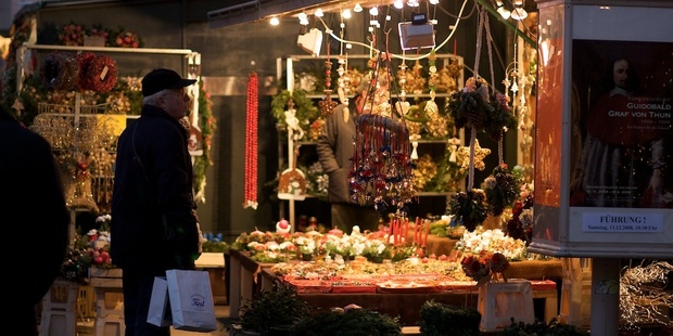 A man browses the Christmas market stalls in Salzburg. Photo / Creative Commons image by Flickr user Ivailo Djilianov