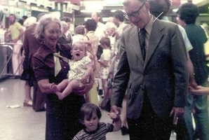 When Adrian Littlewood arrived in New Zealand as a 4-year-old (centre, with his grandparents) in 1975, the terminal's exposed steel beams betrayed its original use as a cargo shed.