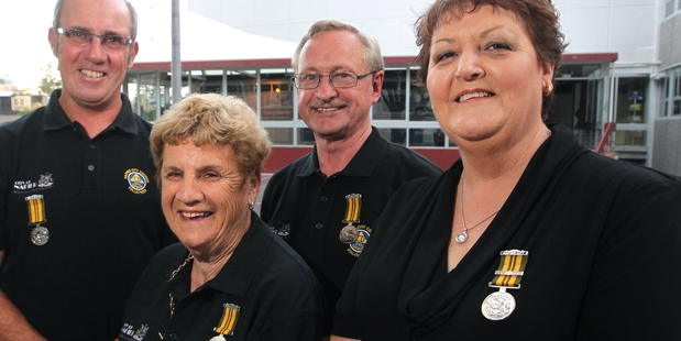 TOP TEAM: Napier Civil Defence's long-service crew of (left) Stephen McLean, Burnie Cave, Kerry Rusbridge and Lois Watson received an award medal from director John Hamilton and Mayor Bill Dalton.PHOTO/DUNCAN BROWN HBT134528-01