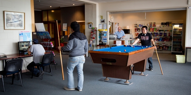 Sailors play pool at the Seafarers Centre. Photo / Sarah Ivey