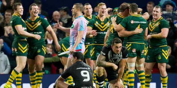 Sonny Bill Williams and Issac Luke can't hide their disappointment as Australia celebrate their win at Old Trafford. Photo / AP