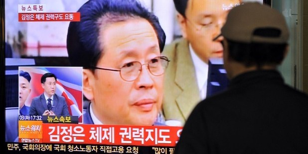 A South Korean man watches TV news about the dismissal of Jang Song-Thae. Photo / AFP