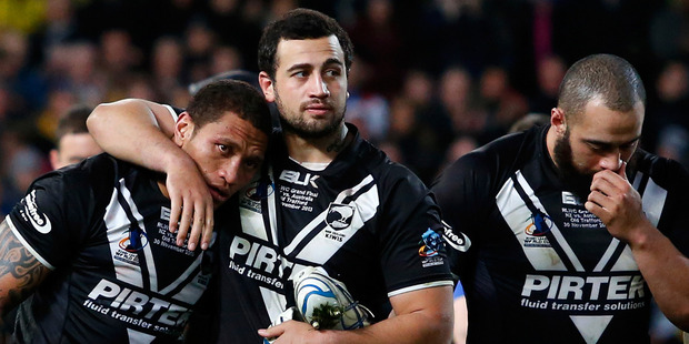 Manu Vatuvei, Ben Matulino and Sam Kasiano of New Zealand show their dejection after the Rugby League World Cup final between New Zealand and Australia. Photo / Getty Images.