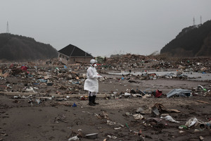 Search teams sift through rubble in Rikuzentakata, Japan. Photo / Getty Images
