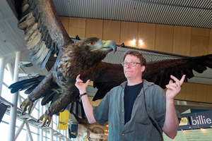 Richard Taylor with one of the giant great eagles created by Weta Workshop and installed at Wellington International Airport. Photo / Mark Mitchell