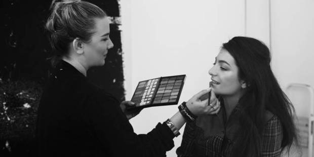M.A.C makeup artist Amber D, photographed here at a magazine shoot with Lorde, has been travelling with the singer, working on her signature look. Photo / Olivia Hemus