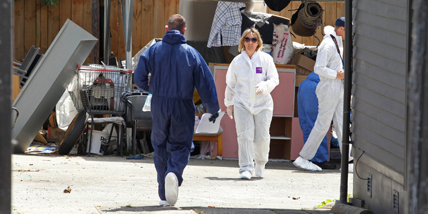 Police investigators scour the scene where Lance Scullin died o Sunday morning. Photo/John Borren.