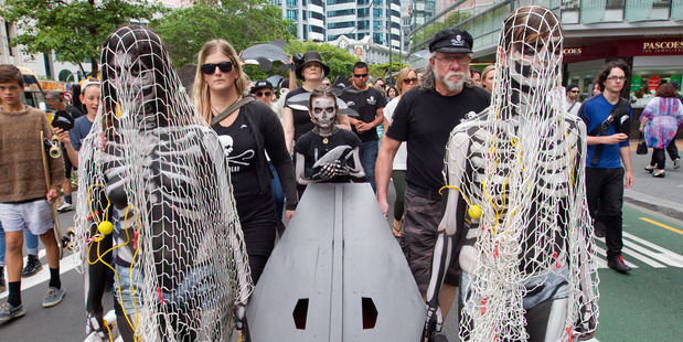 The protest group carries its coffin along Lambton Quay to Parliament yesterday. Photo / Mark Mitchell