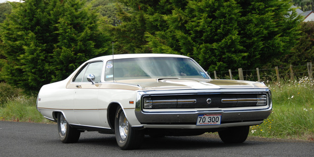 Classic car collector Clifford Brice and his beloved Chrysler 300C Hurst. It's a smooth ride and will also do a standing quarter-mile in very tidy time. Picture / Jacqui Madelin