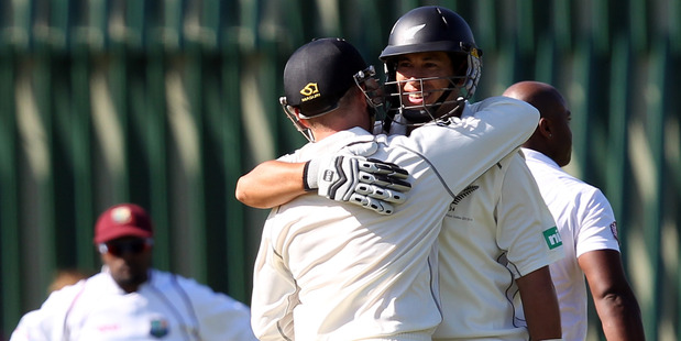 Ross Taylor and Brendon McCullum congratulate each other after both scored centuries yesterday. Photo / Getty Images