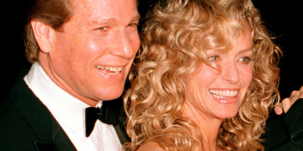 Ryan O'Neal with Farrah Fawcett.