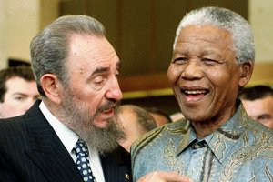 Cuban leader Fidel Castro, left, shares a laugh with South Africa President Nelson Mandela. Photo /AP