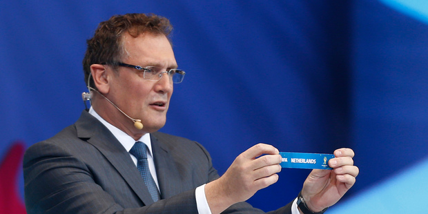 FIFA Secretary General Jerome Valcke holds the ticket of the Netherlands during the draw ceremony for the 2014 soccer World Cup in Costa do Sauipe near Salvador, Brazil. Photo / AP