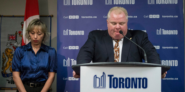 Toronto Mayor Rob Ford stands with his wife, Renata, at a news conference in Toronto. Photo / AP