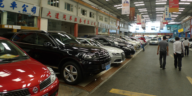 Few visitors to the annual Guangzhou car show have anything but a shiny new set of wheels in mind but the second-hand market is taking off. Pictures / AP