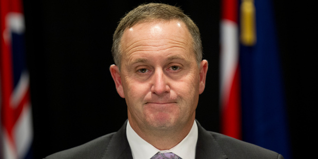 John Key - he charms us with his fetching smile and soothing words to ebb our resistance away. Photo / Mark Mitchell
