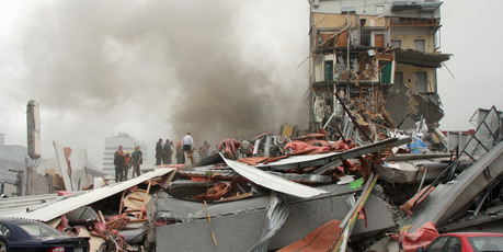 Police and volunteers rescuing people trapped in the CTV building. Photo / APN