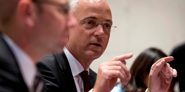 New Zealand dairy giant Fonterra's Chief Executive Officer Theo Spierings, right, speaks during a press conference at a hotel in Beijing. Photo / NZ Herald.