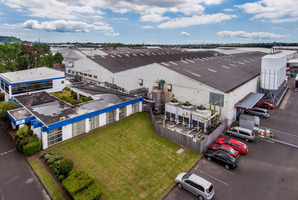 Exterior elevated view of a large industrial site for lease at 100 Carbine Rd, Mt Wellington.