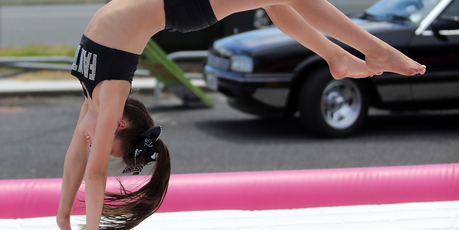 BIG BOUNCE: Within minutes of this photo being taken, cheerleader Grace Hegh was rushed to hospital. PHOTO/JOHN STONE
