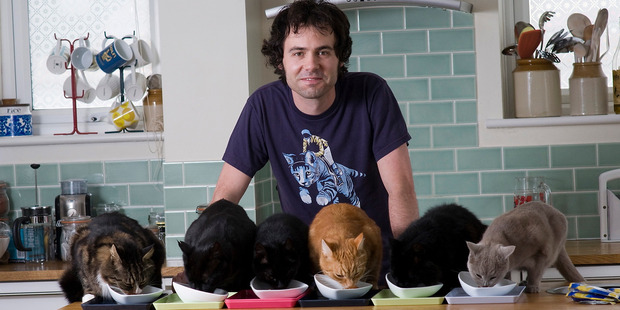 Tom Cox with his housemates. 'if someone likes cats, it says something good about someone to be bonding with animals in that way,' he says.