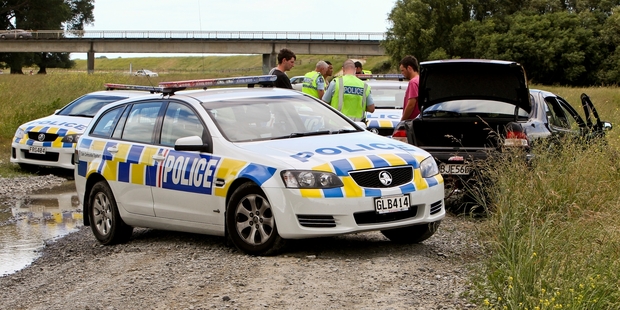 Police arrested the driver of this stolen car under the Pakowhai Rd bridge on Saturday. Photo/Glen Taylor.