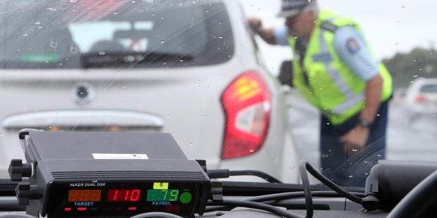 Inspector Murray Hodson talks to a driver nabbed travelling in excess of the 4km/h tolerance and doing 110km/h on State Highway 1. Photo/Michael Cunningham