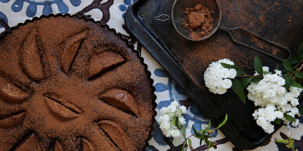 Chocolate and prune hazelnut torte topped with pears. Photo / Eleanor Ozich
