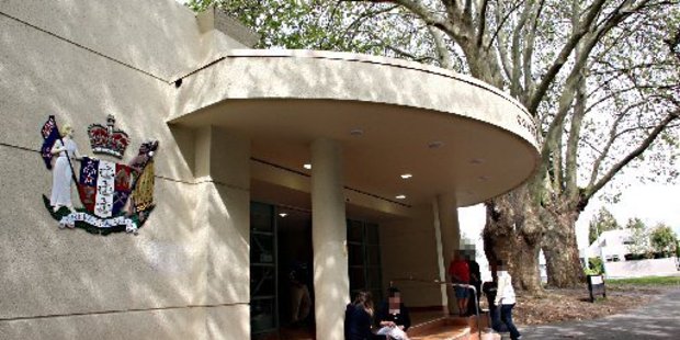 Graffiti on the Tauranga Court House. Main Entrance steps BOP 12Jul12 - REHEARING GRANTED: Lisa Edwards leaves Tauranga court following an earlier appearance.BLUNDER: Evidence not record