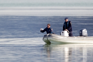 Police searched near Mangere Bridge in May last year for a father and son who drowned when their dinghy capsized. Photo / Sarah Ivey