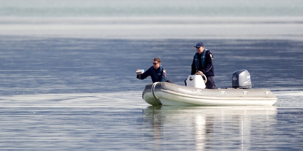 Police searched near Mangere Bridge in May last year for a father and son who drowned when their dinghy capsized. Photo / Sarah Ivey