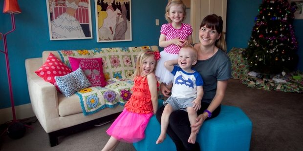 Annick Larkin with Lottie, Esther and Tom in the room where the murders took place. Mrs Larkin and husband Tim are not bothered by the house's gruesome past. Photo / Natalie Slade