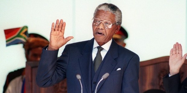 Nelson Mandela taking the oath on 10 May 1994 during his inauguration at the Union Building in Pretoria. Photo / AFP