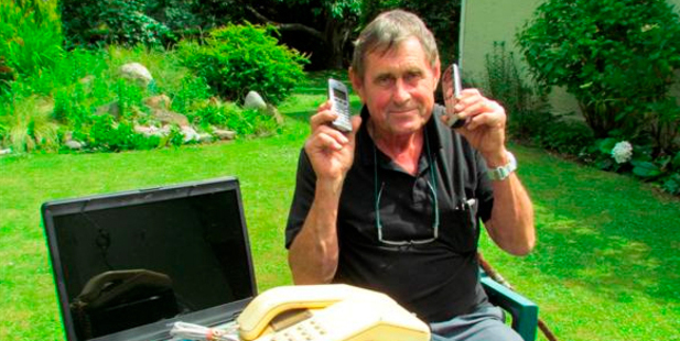 Don Sutherland, of Papakaio, with the equipment damaged when his house was hit by lightning. Photo / Andrew Ashton