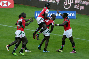 Willy Ambaka (R) of Kenya is congratulated on his winning try. Photo / Getty Images