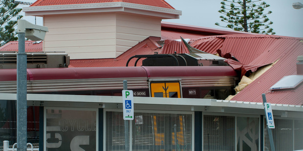 A passenger train sits crashed into the station building at the Cleveland Railway Station in Brisbane. Photo / AAP