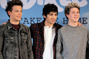 An Australian waitress claims she slept with One Direction singer Zayn Malik, centre. Photo / AP