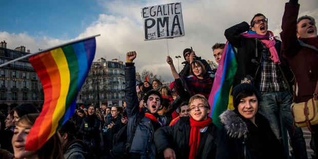 People demonstrate for the government project to legalise same-sex marriage and adoption for same-sex couples in Paris. Photo / AP