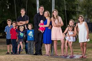 Craig and Melanie Jackson with their 10 children, who range in age from six weeks to 16 years.Photo / Stephen Barker