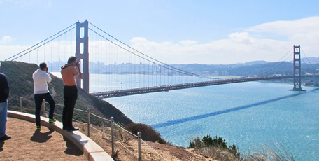Tourists get a perfect shot of the Golden Gate Bridge at the entrance to San Francisco Bay. Fog would have prevented them seeing the bridge earlier in the day. Photo / Alex Robertson